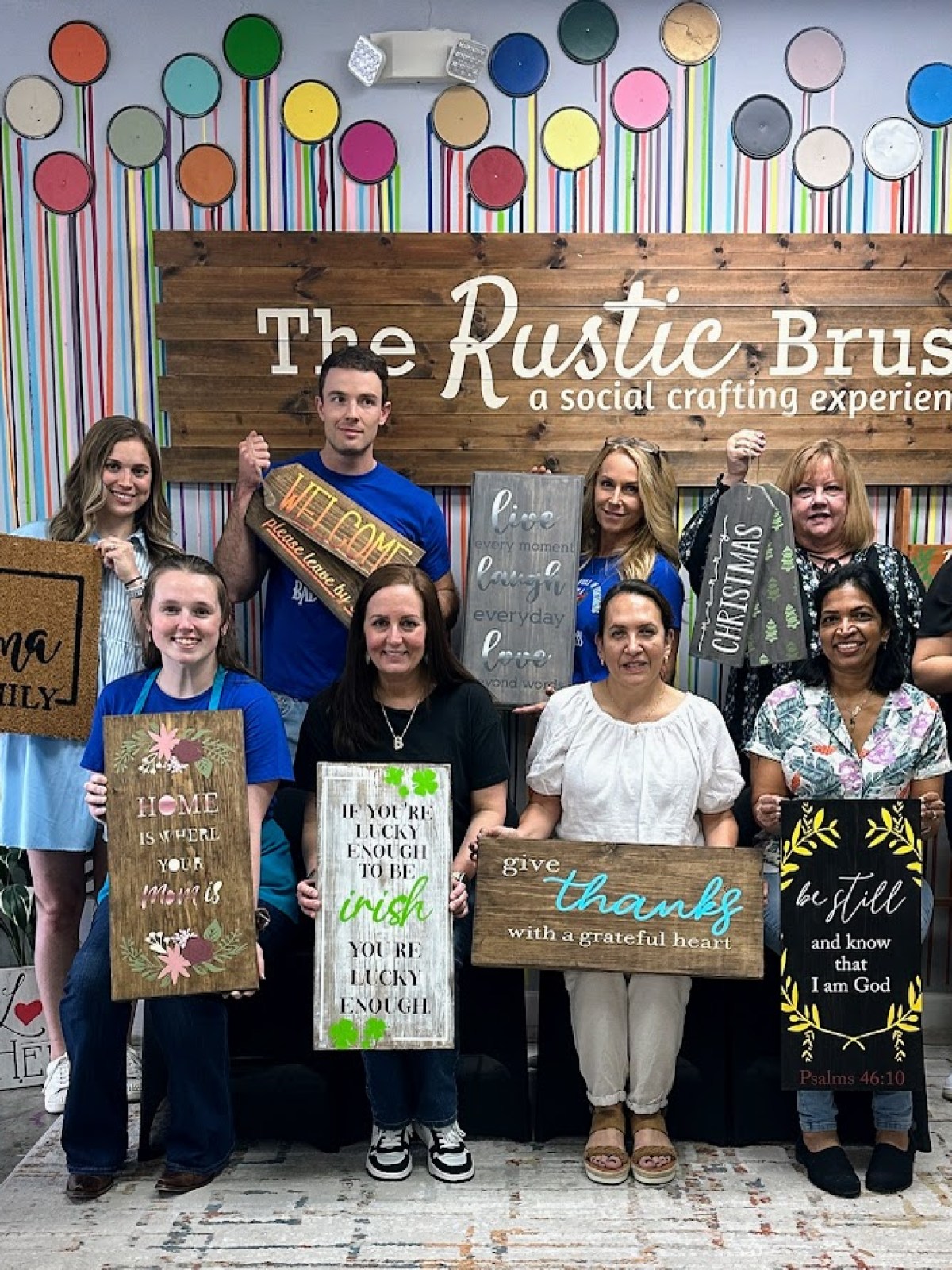 Laura Smulders et al. posing for a photo in front of a store
