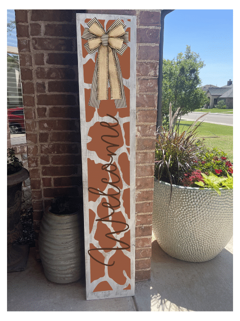 a sign in front of a brick wall