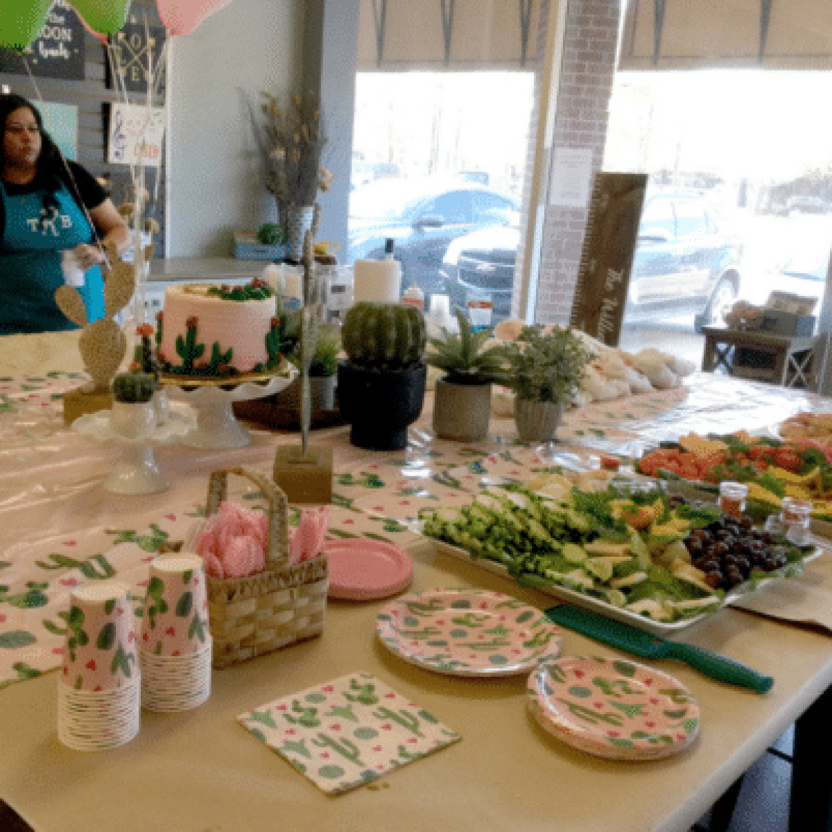 a woman sitting at a table with food