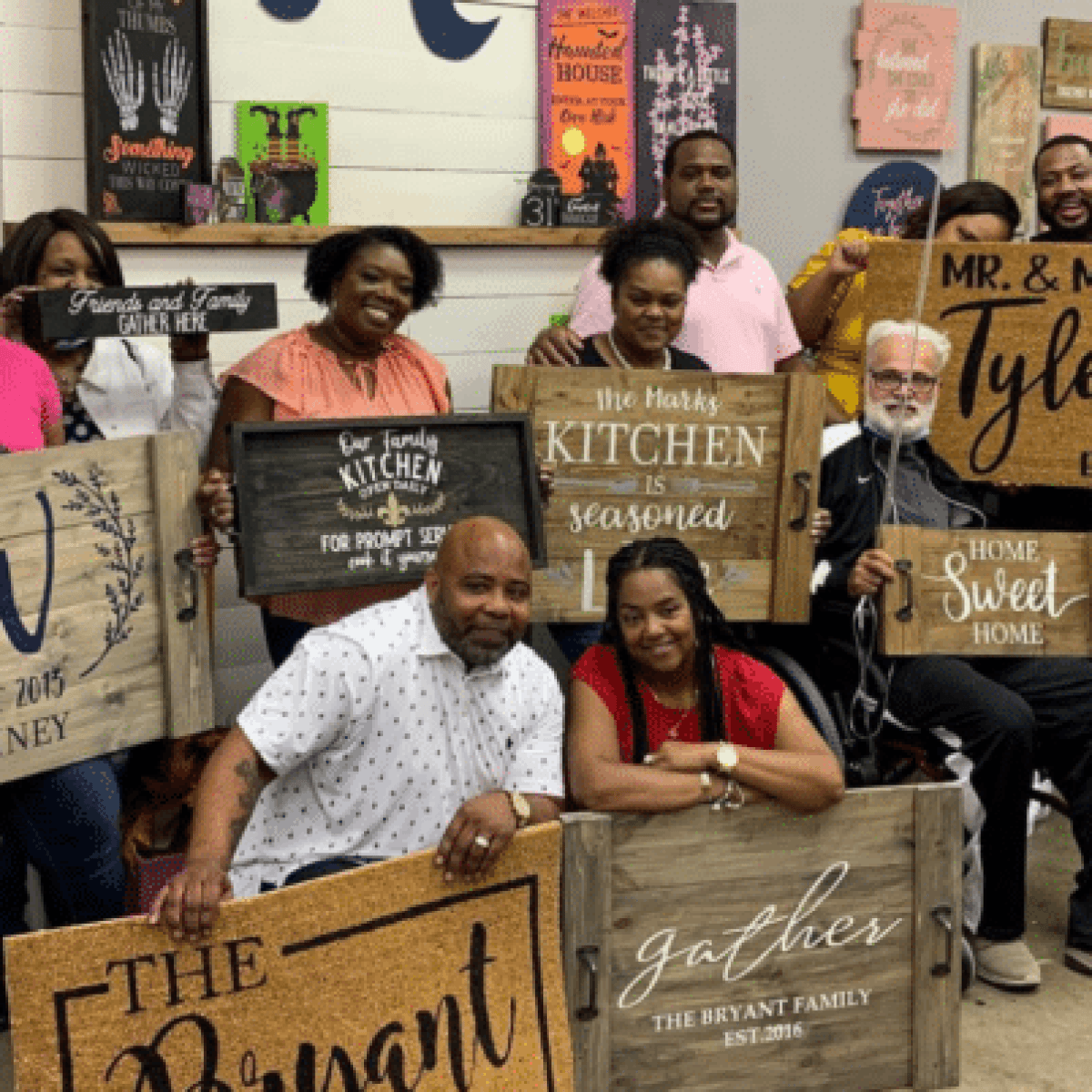 a group of people holding a sign