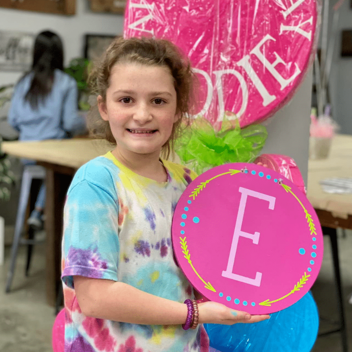 a little girl posing for a picture