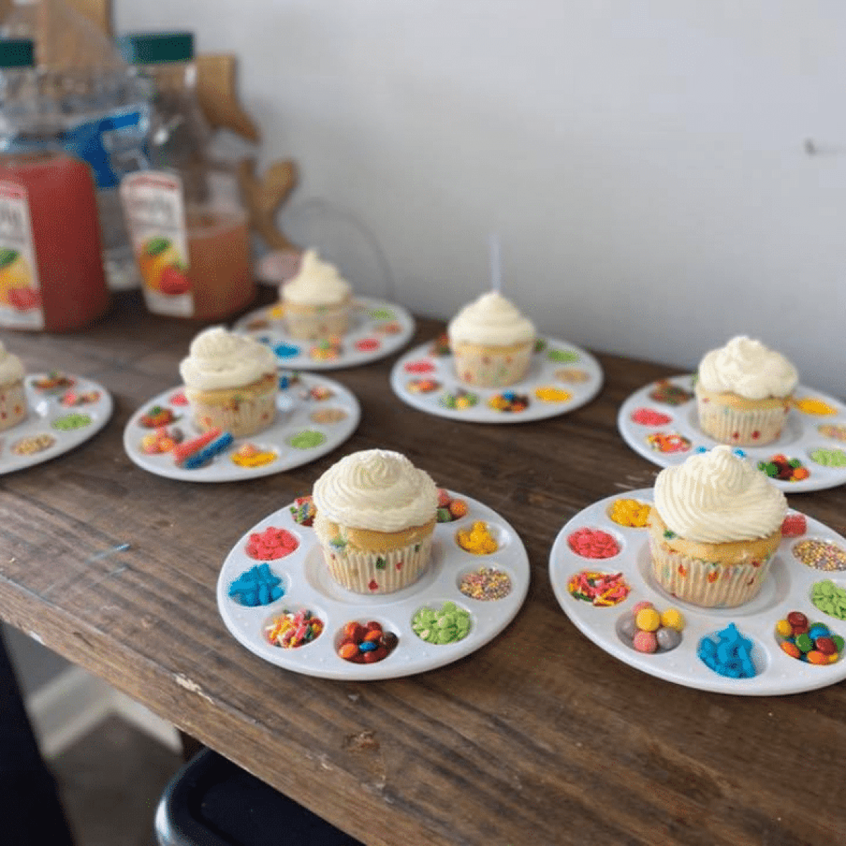 a wooden table topped with plates of food on a plate
