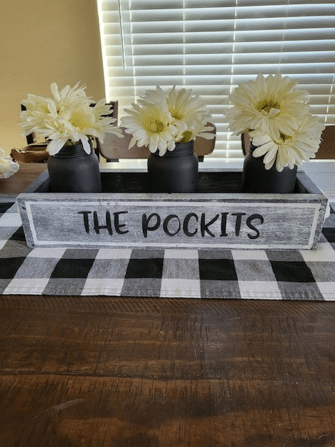 a vase of flowers on a table