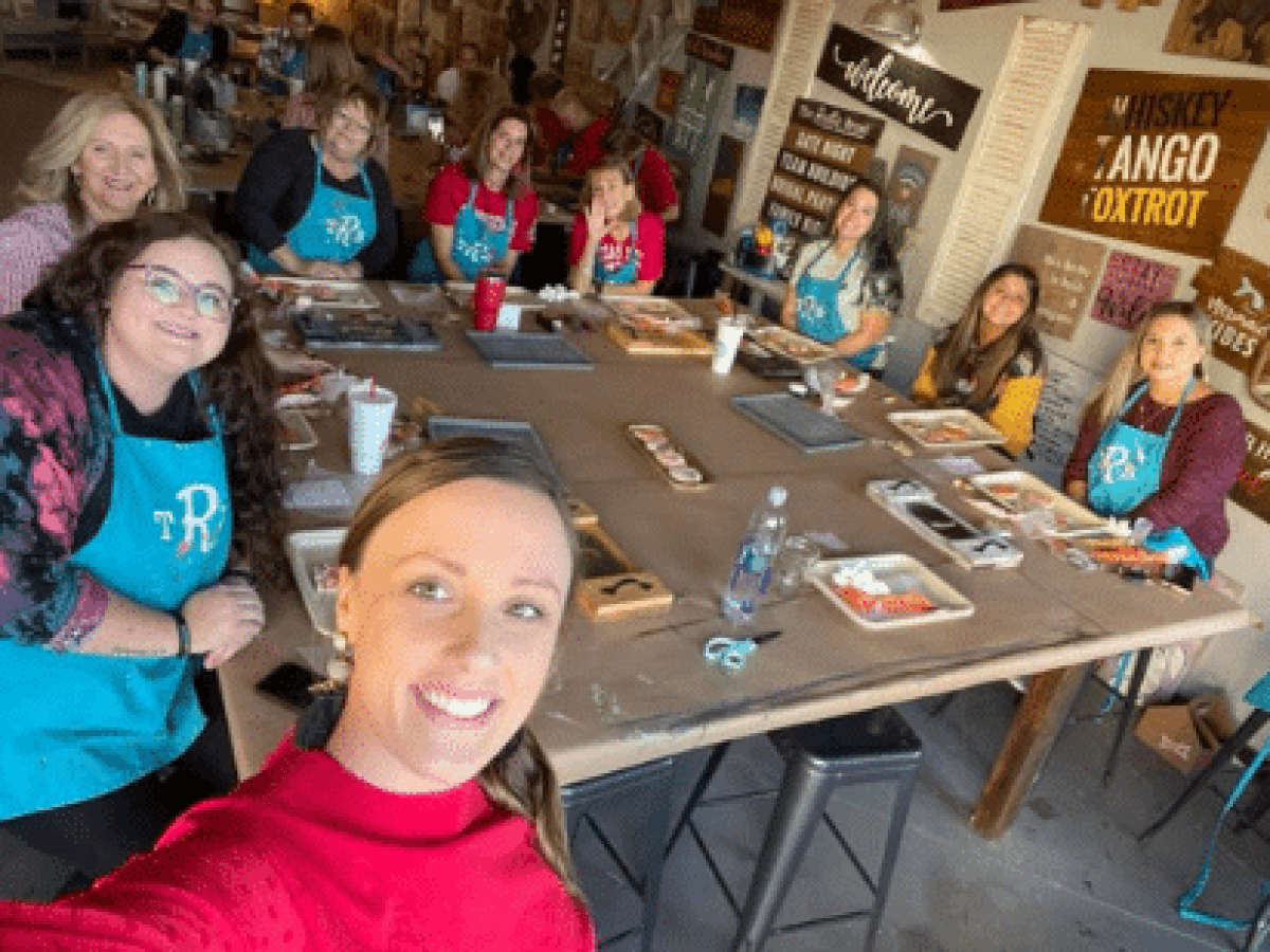 a group of people sitting at a table