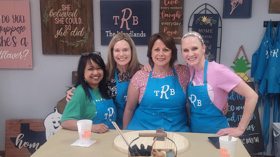 Lene Maria Christensen et al. sitting at a table posing for the camera