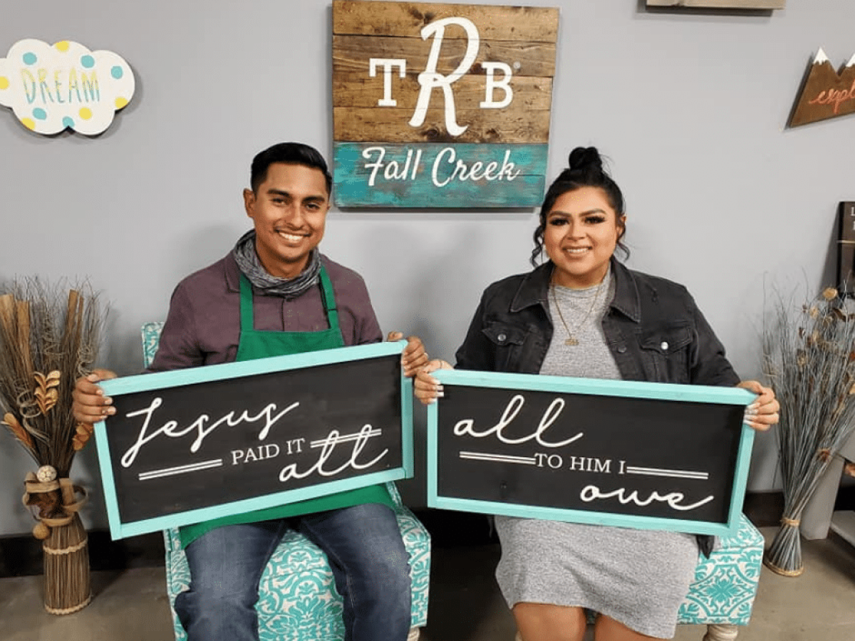 a group of people holding a sign