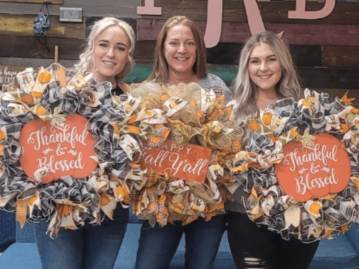 a statue of a man and woman posing for a picture