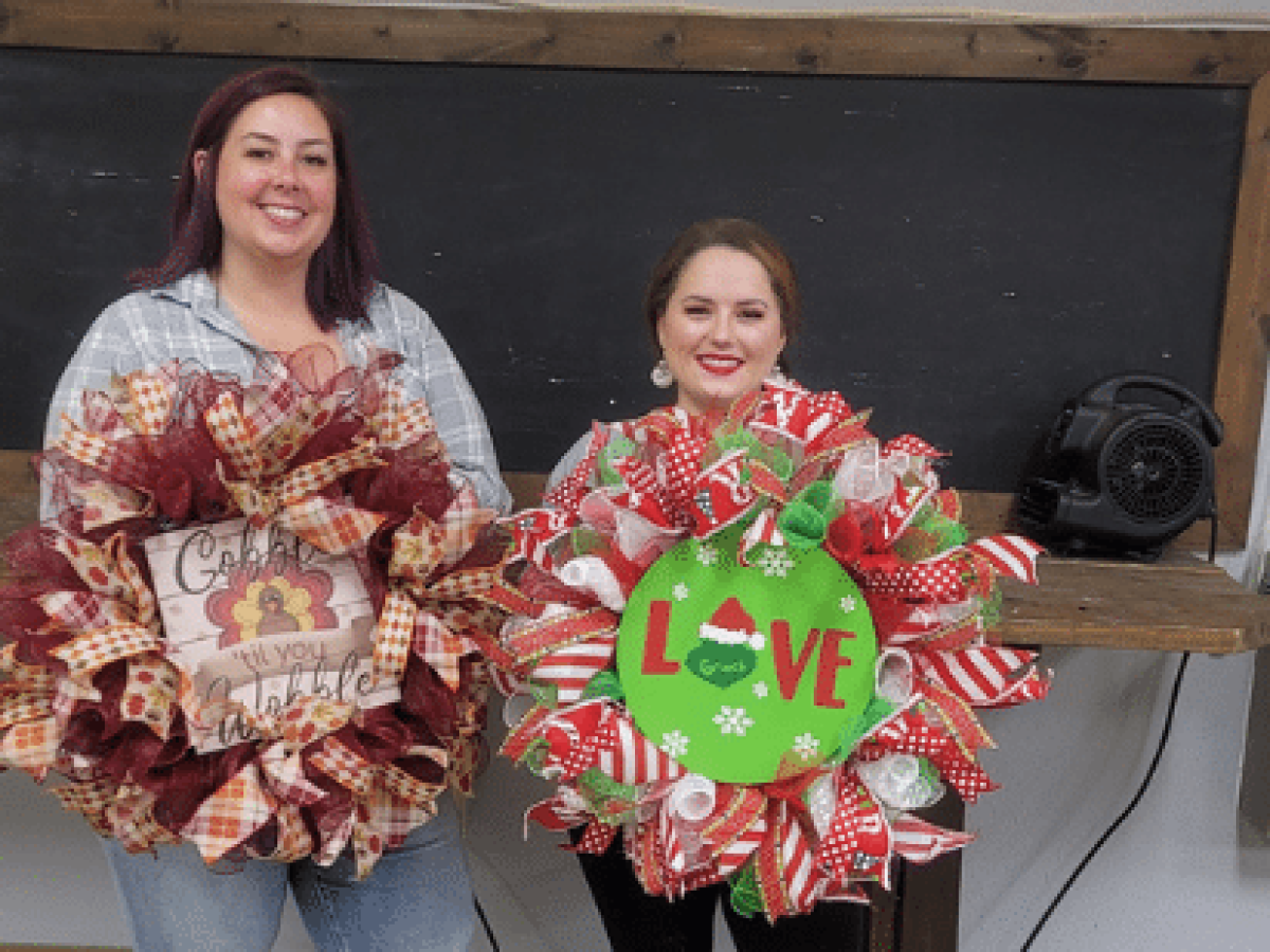 a person holding a birthday cake