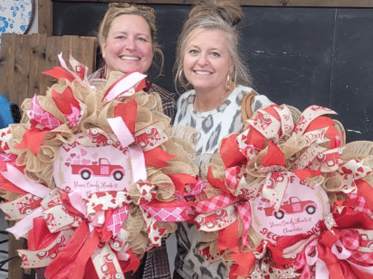 a person standing next to a teddy bear