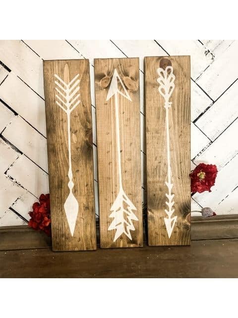 a clock on top of a wooden door