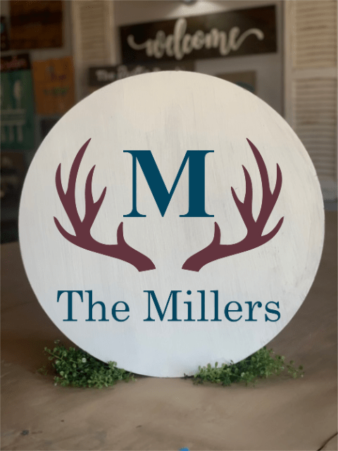 Round sign with antlers and 'M The Millers' wording.