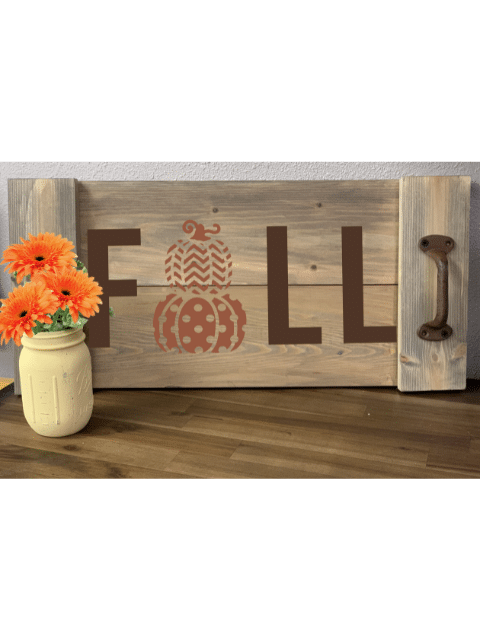 a vase sitting on top of a wooden table