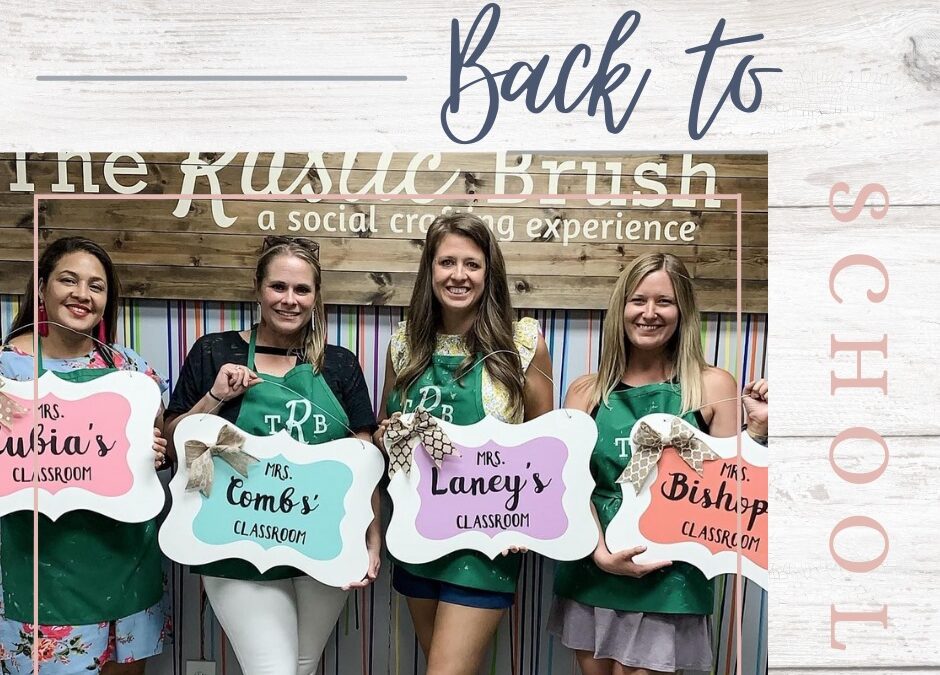 Sindhu Joy et al. holding a sign posing for the camera