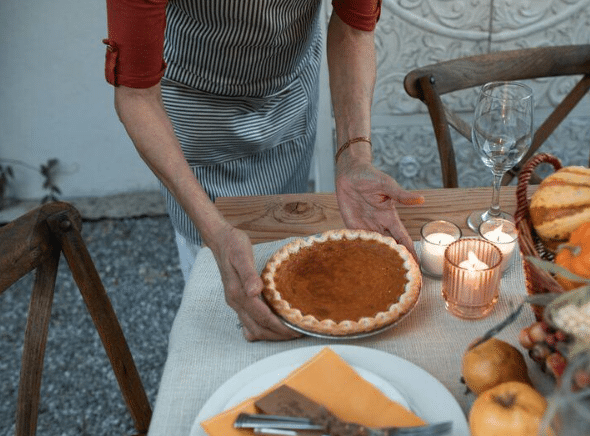 a person sitting at a table with food