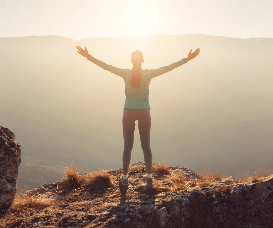 a person standing on a rock