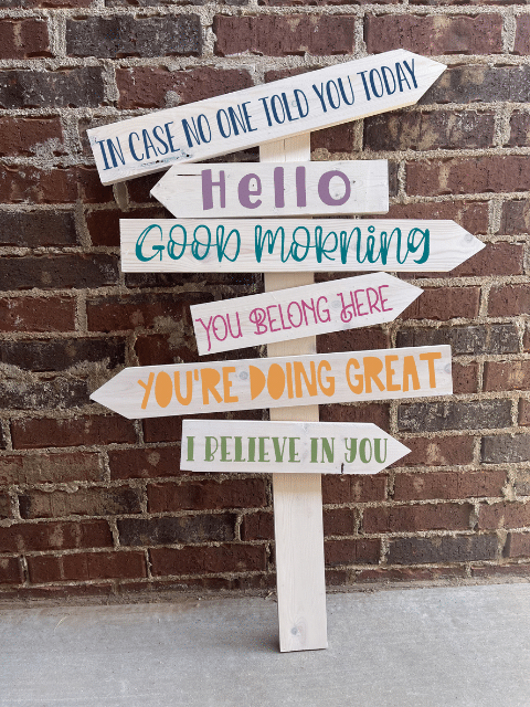 a sign in front of a brick building