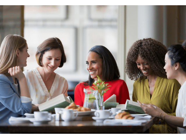 a group of people sitting at a table