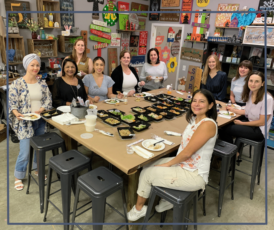 a group of people sitting at a table