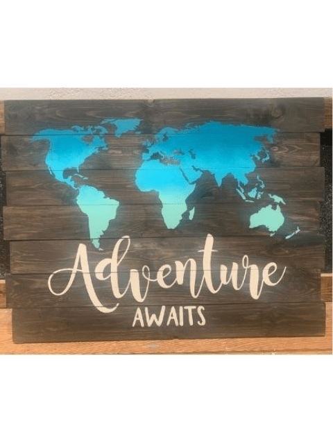 Wooden sign with world map in blue and text 'Adventure Awaits' in white.
