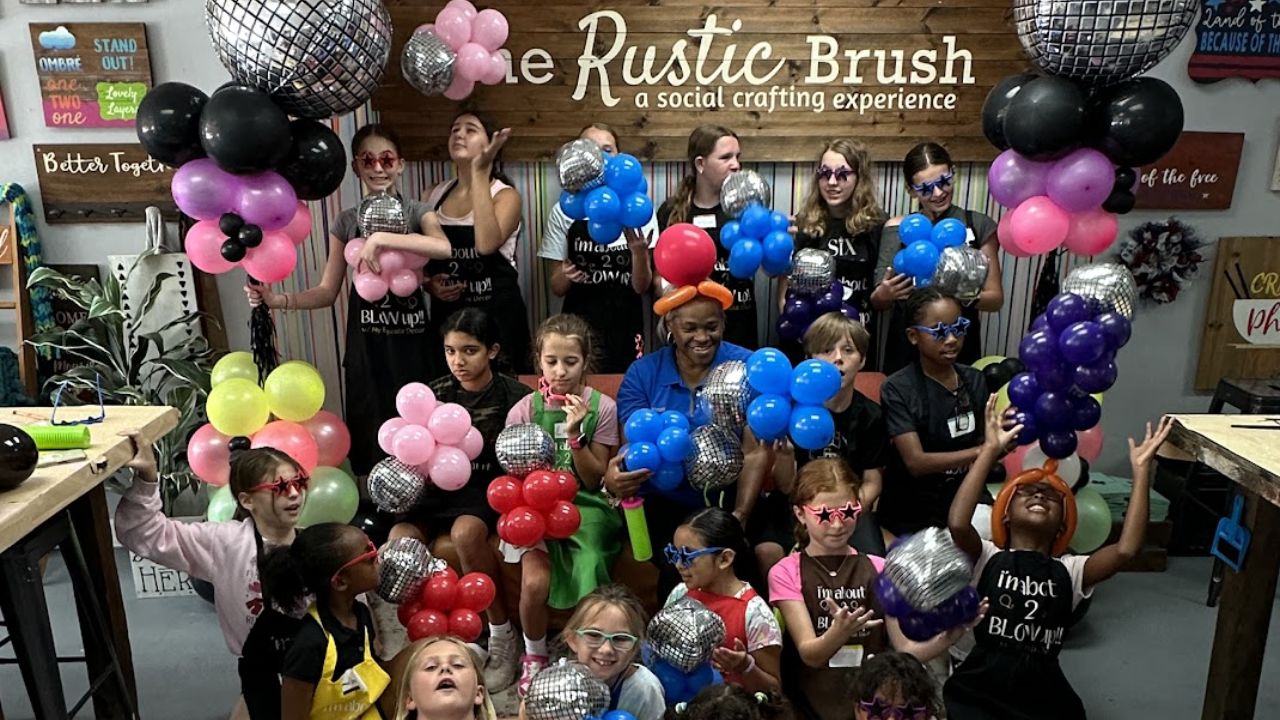 Kids enjoying a fun balloon activity at a children’s art camp
