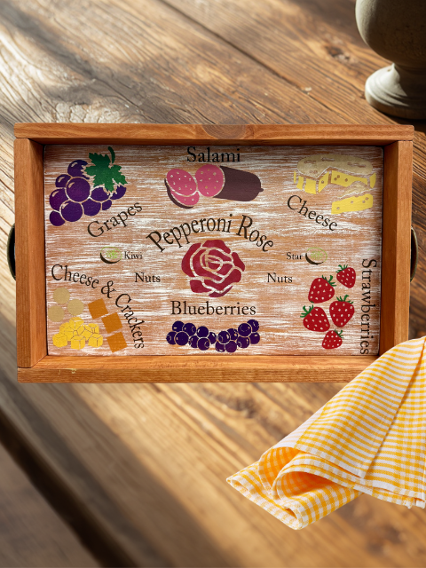 Wooden tray with cheese, salami, grapes, strawberries, nuts, and crackers images and text.