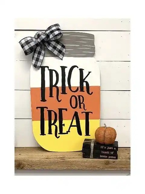 Candy corn mason jar sign reading "TRICK OR TREAT".